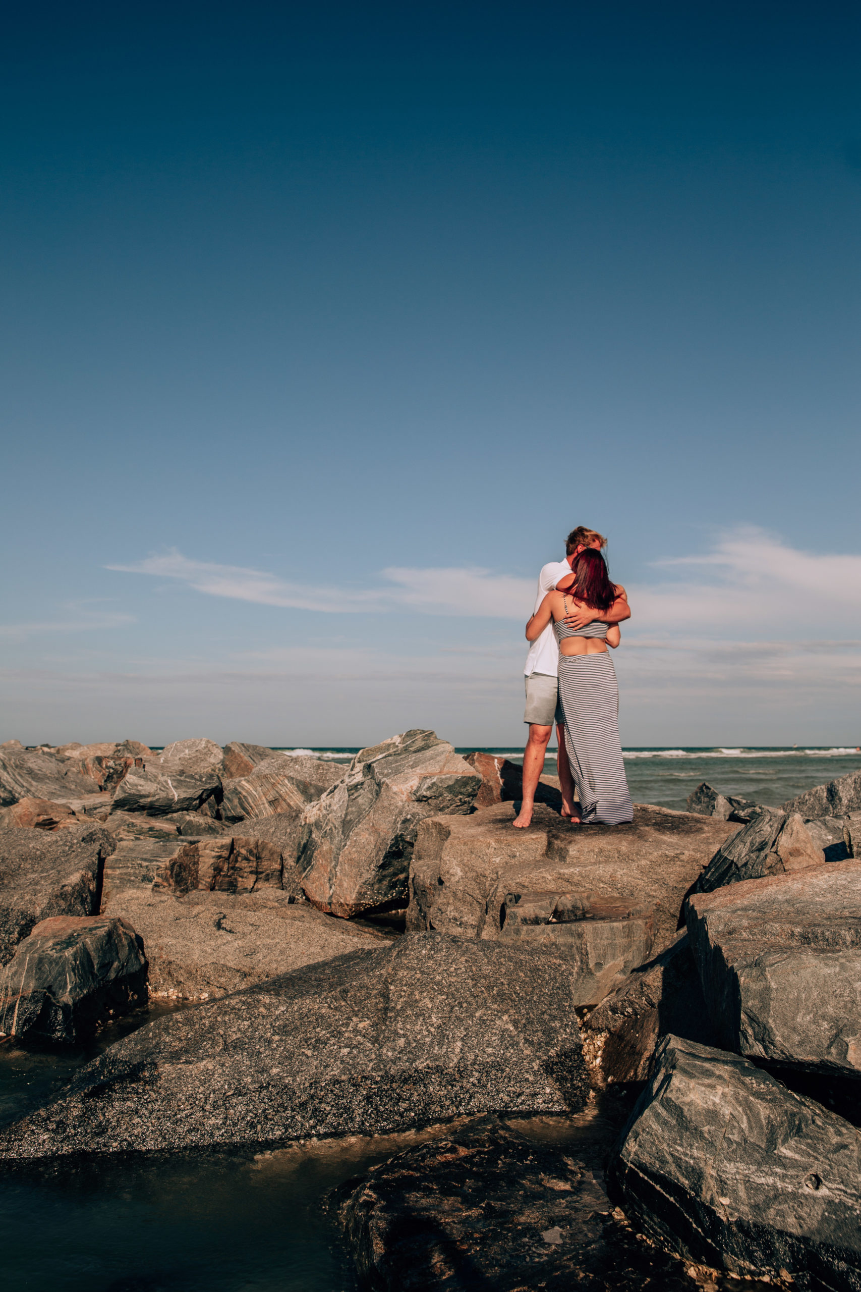 Couple standing on rocks