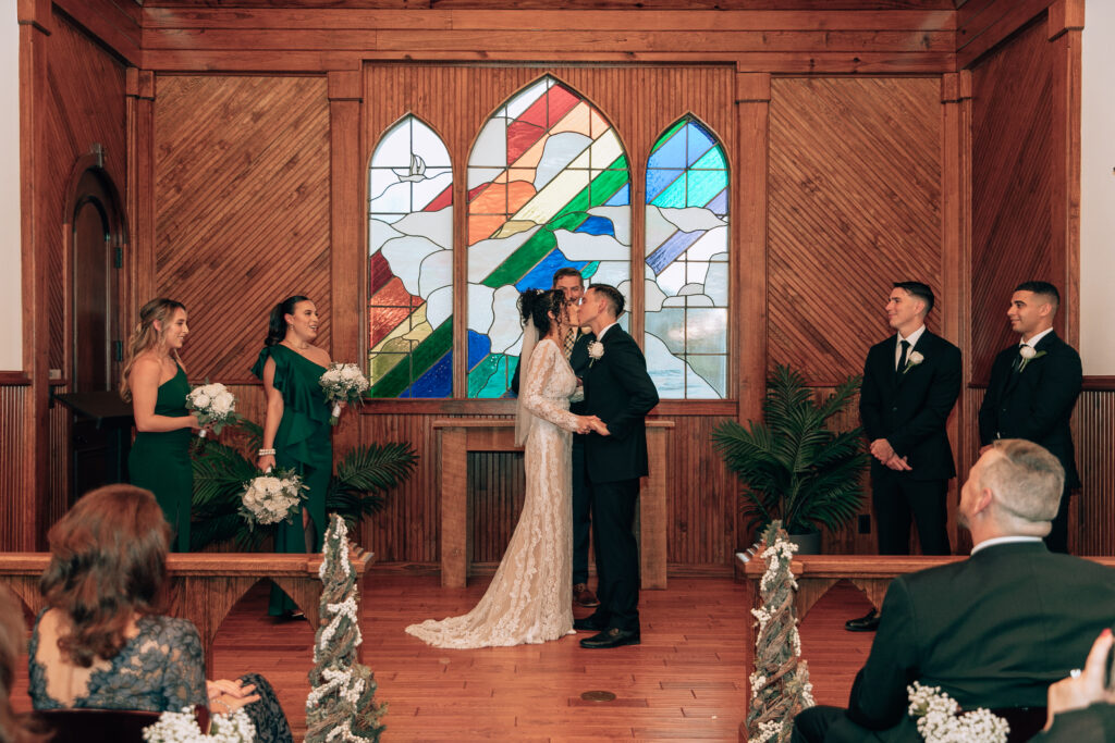 bride and grooms first kiss at chapel valley farm