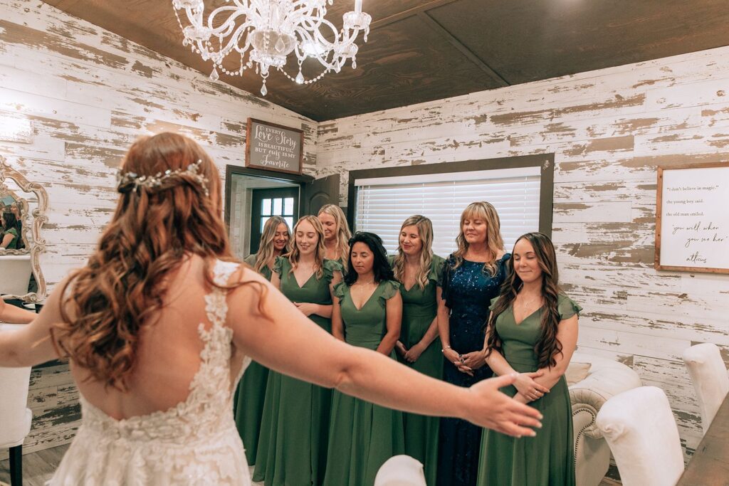 bride does a first look with her bridesmaids